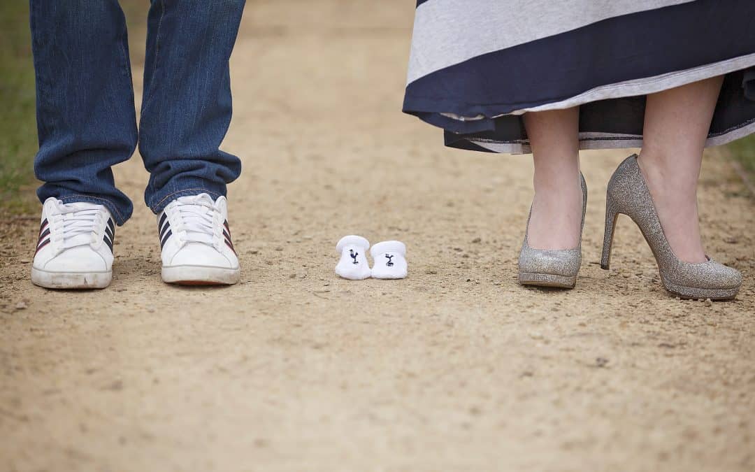 mum and dad with baby booties maternity photoshoot outfit idea